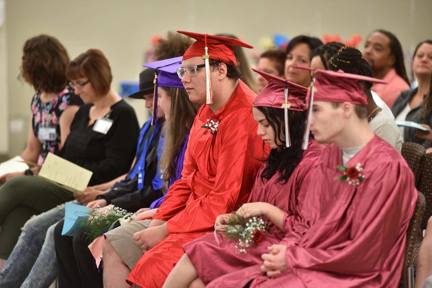 Natchaug students in caps and gowns during graduation ceremony as part of transition services